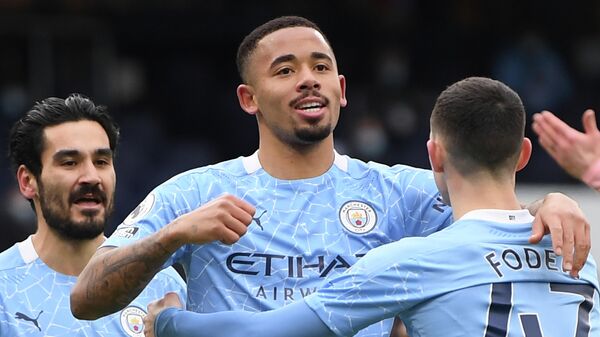 Manchester City's Brazilian striker Gabriel Jesus (C) celebrates scoring the opening goal during the English Premier League football match between Manchester City and Sheffield United at the Etihad Stadium in Manchester, north west England, on January 30, 2021. (Photo by Michael Regan / POOL / AFP) / RESTRICTED TO EDITORIAL USE. No use with unauthorized audio, video, data, fixture lists, club/league logos or 'live' services. Online in-match use limited to 120 images. An additional 40 images may be used in extra time. No video emulation. Social media in-match use limited to 120 images. An additional 40 images may be used in extra time. No use in betting publications, games or single club/league/player publications. / 