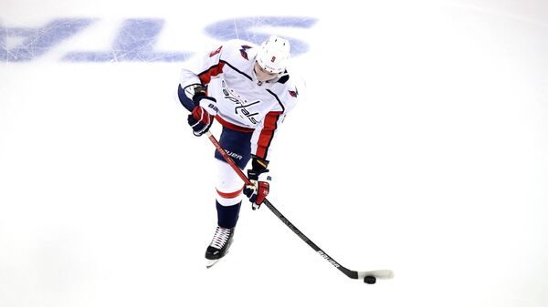 TORONTO, ONTARIO - AUGUST 06: Dmitry Orlov #9 of the Washington Capitals warms up prior to the Eastern Conference Round Robin game against the Philadelphia Flyers during the 2020 NHL Stanley Cup Playoffs at Scotiabank Arena on August 06, 2020 in Toronto, Ontario, Canada.   Andre Ringuette/Freestyle Photo/Getty Images/AFP