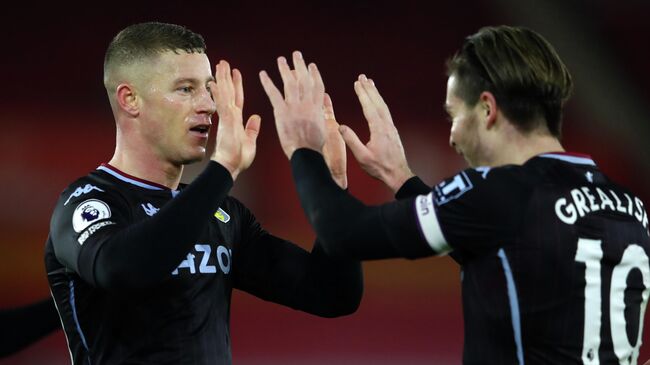 Aston Villa's English midfielder Ross Barkley celebrates with Aston Villa's English midfielder Jack Grealish (R) after scoring the opening goal of the English Premier League football match between Southampton and Aston Villa at St Mary's Stadium in Southampton, southern England on January 30, 2021. (Photo by Michael Steele / POOL / AFP) / RESTRICTED TO EDITORIAL USE. No use with unauthorized audio, video, data, fixture lists, club/league logos or 'live' services. Online in-match use limited to 120 images. An additional 40 images may be used in extra time. No video emulation. Social media in-match use limited to 120 images. An additional 40 images may be used in extra time. No use in betting publications, games or single club/league/player publications. / 