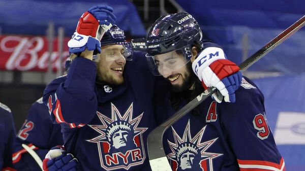 NEW YORK, NEW YORK - FEBRUARY 04: (l-r) Artemi Panarin #10 and Mika Zibanejad #93 of the New York Rangers celebrate their 4-2 victory over the Washington Capitals at Madison Square Garden on February 04, 2021 in New York City.   Bruce Bennett/Getty Images/AFP