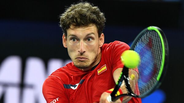 Spain's Pablo Carreno Busta hits a return against Greece's Michail Pervolarakis during their group B ATP Cup singles match in Melbourne on February 5, 2021. (Photo by William WEST / AFP) / -- IMAGE RESTRICTED TO EDITORIAL USE - STRICTLY NO COMMERCIAL USE --