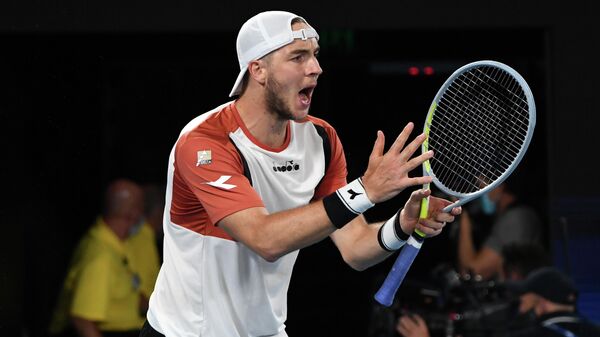 Germany's Jan-Lennard Struff reacts as he plays with Germany's Alexander Zverev against Serbia's Novak Djokovic and Nikola Cacic in their ATP Cup group A men's doubles tennis match in Melbourne on February 5, 2021. (Photo by Paul CROCK / AFP) / -- IMAGE RESTRICTED TO EDITORIAL USE - STRICTLY NO COMMERCIAL USE --
