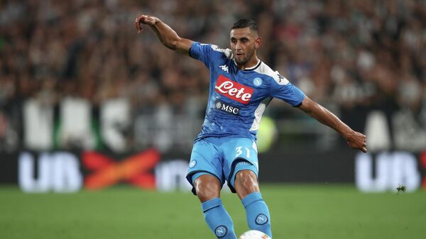 Napoli's Algerian defender Faouzi Ghoulam passes the ball during the Italian Serie A football match Juventus vs Napoli on August 31, 2019 at the Juventus stadium in Turin. (Photo by Isabella Bonotto / AFP)
