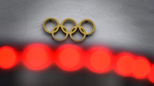 The Olympic Rings are seen at the headquarters of the International Olympic Committee (IOC) in Lausanne on February 3, 2021. (Photo by Fabrice COFFRINI / AFP)