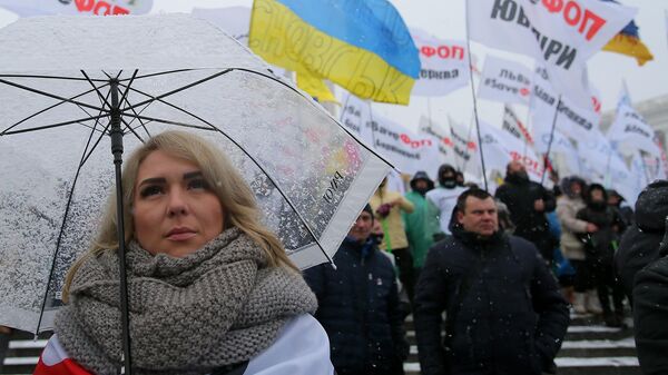 Участница всеукраинской акции за налоговые послабления для малого бизнеса на Майдане Незалежности в Киеве