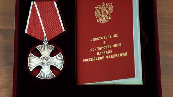 На церемонии вручения орденов Мужества родственникам погибших пожарных в Красноярске