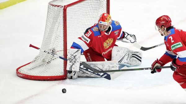 Russia's goalkeeper Alexander Samonov eyes the puck during the Beijer Hockey Games (Euro Hockey Tour) icehockey match between Russia and Finland in Malmo, Sweden, on February 11, 2021. (Photo by Anders Bjuro / TT News Agency / AFP) / Sweden OUT