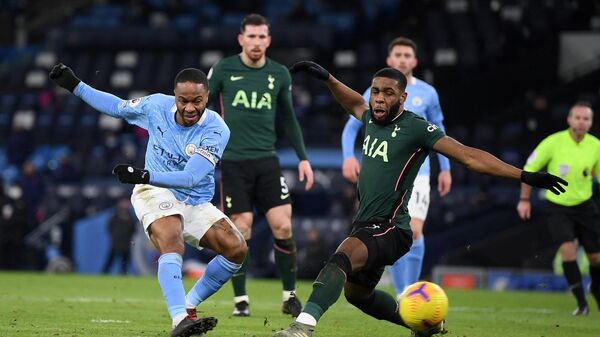 Manchester City's English midfielder Raheem Sterling (L) shoots past Tottenham Hotspur's English midfielder Japhet Tanganga but has his shot saved during the English Premier League football match between Manchester City and Tottenham Hotspur at the Etihad Stadium in Manchester, north west England, on February 13, 2021. (Photo by Shaun Botterill / POOL / AFP) / RESTRICTED TO EDITORIAL USE. No use with unauthorized audio, video, data, fixture lists, club/league logos or 'live' services. Online in-match use limited to 120 images. An additional 40 images may be used in extra time. No video emulation. Social media in-match use limited to 120 images. An additional 40 images may be used in extra time. No use in betting publications, games or single club/league/player publications. / 
