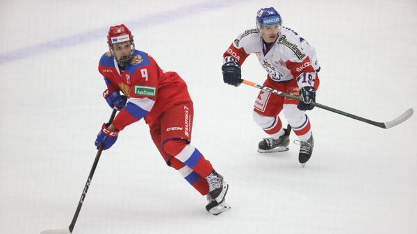 Russia's Nikita Chibrikov (L) and Czech Republic's Petr Kodytek  during Euro Hockey Tour between Russia and Czech Republic on February 14, 2021, at Malmoe Arena in Sweden. (Photo by Andreas HILLERGREN / TT NEWS AGENCY / AFP) / Sweden OUT