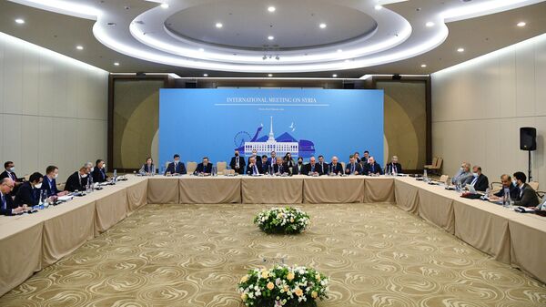Представители турецкой, российской и иранской делегаций на XV Международной встрече по Сирии в Сочи