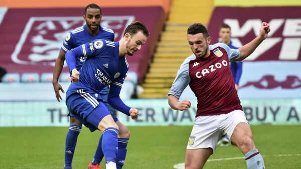 Leicester City's English midfielder James Maddison (L) vies with Aston Villa's Scottish midfielder John McGinn (R) during the English Premier League football match between Aston Villa and Leicester City at Villa Park in Birmingham, central England on February 21, 2021. (Photo by Rui Vieira / POOL / AFP) / RESTRICTED TO EDITORIAL USE. No use with unauthorized audio, video, data, fixture lists, club/league logos or 'live' services. Online in-match use limited to 120 images. An additional 40 images may be used in extra time. No video emulation. Social media in-match use limited to 120 images. An additional 40 images may be used in extra time. No use in betting publications, games or single club/league/player publications. / 