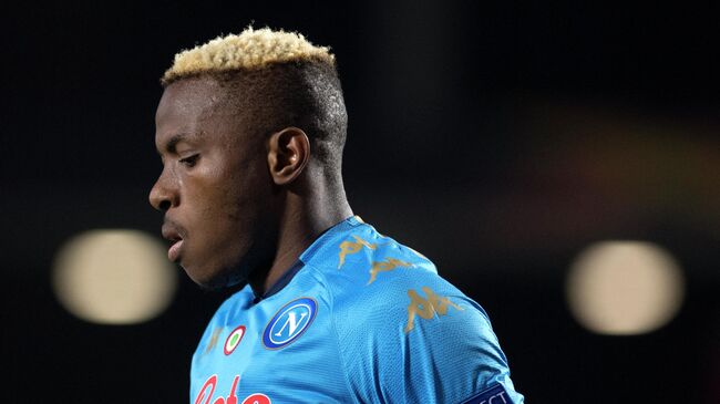 Napoli's Nigerian forward Victor Osimhen reacts during the UEFA Europa League round of 32 first leg football match between Granada FC and Napoli at Nuevo Los Carmenes stadium in Granada on February 18, 2021. (Photo by JORGE GUERRERO / AFP)