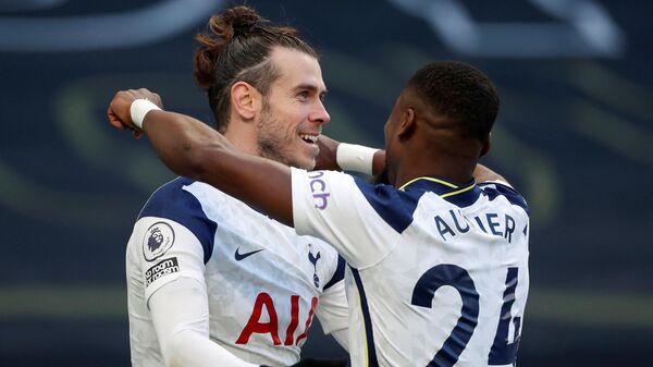 Tottenham Hotspur's Welsh striker Gareth Bale (L) celebrates scoring his team's fourth goal, his second, with Tottenham Hotspur's Ivorian defender Serge Aurier during the English Premier League football match between Tottenham Hotspur and Burnley at Tottenham Hotspur Stadium in London, on February 28, 2021. (Photo by MATTHEW CHILDS / POOL / AFP) / RESTRICTED TO EDITORIAL USE. No use with unauthorized audio, video, data, fixture lists, club/league logos or 'live' services. Online in-match use limited to 120 images. An additional 40 images may be used in extra time. No video emulation. Social media in-match use limited to 120 images. An additional 40 images may be used in extra time. No use in betting publications, games or single club/league/player publications. / 
