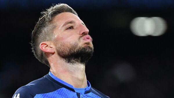 Napoli's Belgian forward Dries Mertens reacts after scoring a penalty during the UEFA Champions League Group E football match Napoli vs Genk on December 10, 2019 at the San Paolo stadium in Naples. (Photo by Tiziana FABI / AFP)