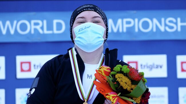 Snowboarding - FIS Snowboard Alpine World Championship - Women's Parallel Giant Slalom - Rogla, Slovenia - March 2, 2021 Russia's Sofia Nadyrshina celebrates after winning gold in the Women's Parallel Giant Slalom on the podium REUTERS/Borut Zivulovic