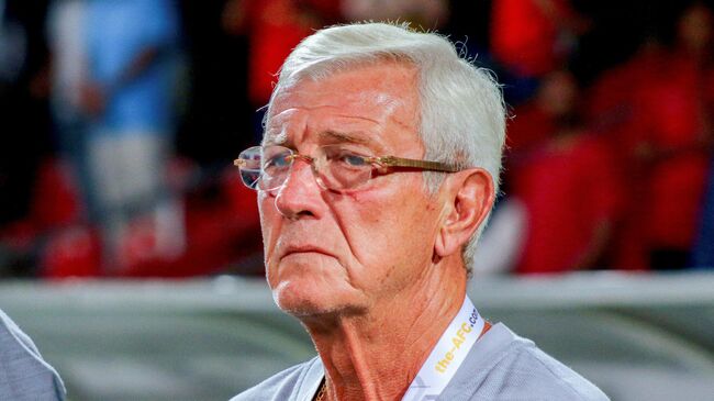 China's head coach Marcello Lippi watches the Qatar 2022 FIFA World Cup second round Group A qualification football match between Maldives and Chian at Rasmee Dhandu National Stadium in Male on September 10, 2019. (Photo by Ahmed SHURAU / AFP)