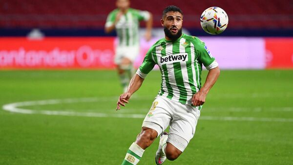 Real Betis' French midfielder Nabil Fekir controls the ball during the Spanish League football match between Atletico Madrid and Real Betis at the Wanda Metropolitan stadium in Madrid on October 24, 2020. (Photo by GABRIEL BOUYS / AFP)