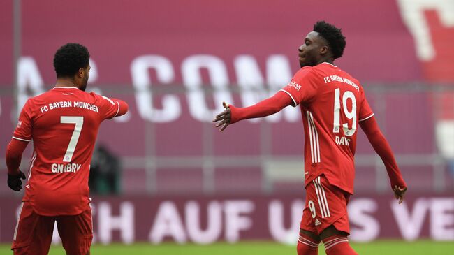Soccer Football - Bundesliga - Bayern Munich v VfB Stuttgart - Allianz Arena, Munich, Germany - March 20, 2021 Bayern Munich's Alphonso Davies walks past Serge Gnabry as he leaves the pitch after being sent off Pool via REUTERS/Andreas Gebert DFL regulations prohibit any use of photographs as image sequences and/or quasi-video.