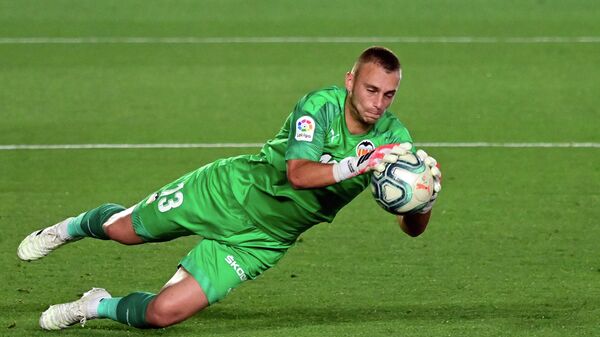 Valencia's Dutch goalkeeper Jasper Cillessen stops the ball during the Spanish league football match between Real Madrid CF and Valencia CF at the Alfredo di Stefano stadium in Valdebebas, on the outskirts of Madrid, on June 18, 2020. (Photo by JAVIER SORIANO / AFP)