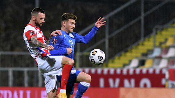 Croatia's midfielder Marcelo Brozovic (L) fights for the ball with Cyprus' forward Marinos Tzionis  during the FIFA World Cup Qatar 2022 qualification Group H football match between Croatia and Cyprus at the HNK Rijeka Stadium, in Rijeka, on March 27, 2021. - Croatia's midfielder Marcelo Brozovic (L) fights for the ball with Cyprus' forward Marinos Tzionis (Photo by Denis LOVROVIC / AFP)