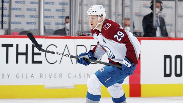 GLENDALE, ARIZONA - MARCH 22: Nathan MacKinnon #29 of the Colorado Avalanche in action during the NHL game against the Arizona Coyotes at Gila River Arena on March 22, 2021 in Glendale, Arizona. The Avalanche defeated the Coyotes 5-1.   Christian Petersen/Getty Images/AFP (Photo by Christian Petersen / GETTY IMAGES NORTH AMERICA / Getty Images via AFP)