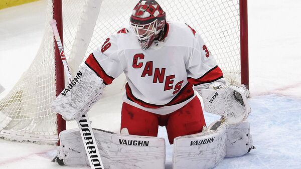 CHICAGO, ILLINOIS - MARCH 30: Alex Nedeljkovic #39 of the Carolina Hurricanes minds the net against the Chicago Blackhawks at the United Center on March 30, 2021 in Chicago, Illinois. The Blackhawks defeated the Hurricanes 2-1.   Jonathan Daniel/Getty Images/AFP (Photo by JONATHAN DANIEL / GETTY IMAGES NORTH AMERICA / Getty Images via AFP)