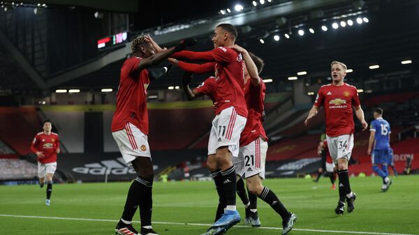 Manchester United's English striker Mason Greenwood celebrates scoring his team's second goal with teammates during the English Premier League football match between Manchester United and Brighton and Hove Albion at Old Trafford in Manchester, north west England, on April 4, 2021. (Photo by Clive Brunskill / POOL / AFP) / RESTRICTED TO EDITORIAL USE. No use with unauthorized audio, video, data, fixture lists, club/league logos or 'live' services. Online in-match use limited to 120 images. An additional 40 images may be used in extra time. No video emulation. Social media in-match use limited to 120 images. An additional 40 images may be used in extra time. No use in betting publications, games or single club/league/player publications. / 