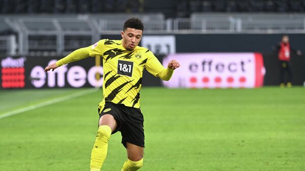 Dortmund's English midfielder Jadon Sancho plays the ball during the German first division Bundesliga football match between Borussia Dortmund and DSC Arminia Bielefeld in Dortmund, western Germany, on February 27, 2021. (Photo by Ina Fassbender / various sources / AFP) / DFL REGULATIONS PROHIBIT ANY USE OF PHOTOGRAPHS AS IMAGE SEQUENCES AND/OR QUASI-VIDEO