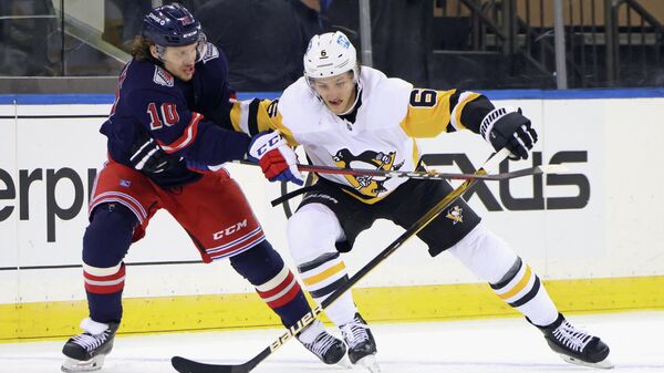 Apr 8, 2021; New York, New York, USA; Pittsburgh Penguins defenseman John Marino (6) plays for the puck against New York Rangers left wing Artemi Panarin (10) during the first period at Madison Square Garden. Mandatory Credit:  Bruce Bennett/Pool Photo-USA TODAY Sports