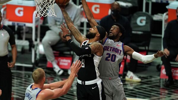 Apr 11, 2021; Los Angeles, California, USA; LA Clippers forward Marcus Morris Sr. (8) is defended by Detroit Pistons guard Josh Jackson (20) and center Mason Plumlee (24)  in the first half at Staples Center. Mandatory Credit: Kirby Lee-USA TODAY Sports
