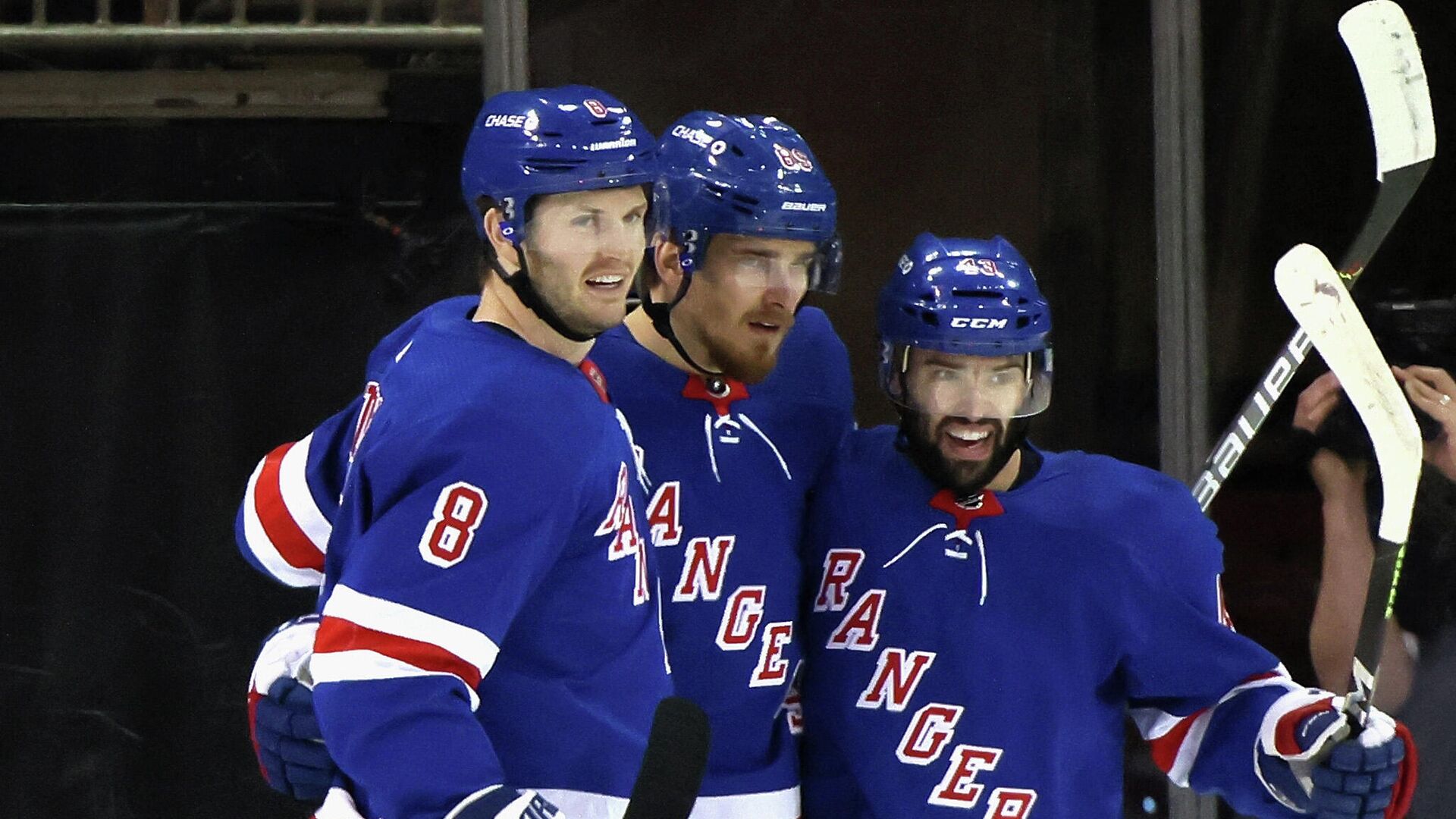 NEW YORK, NEW YORK - APRIL 17: Pavel Buchnevich #89 of the New York Rangers (C) celebrates his 2nd goal of the game at 11:48 of the first period and is joined by Jacob Trouba #8 (L) and Colin Blackwell #43 (R) against the New Jersey Devils at Madison Square Garden on April 17, 2021 in New York City.   Bruce Bennett/Getty Images/AFP (Photo by BRUCE BENNETT / GETTY IMAGES NORTH AMERICA / Getty Images via AFP) - РИА Новости, 1920, 17.04.2021