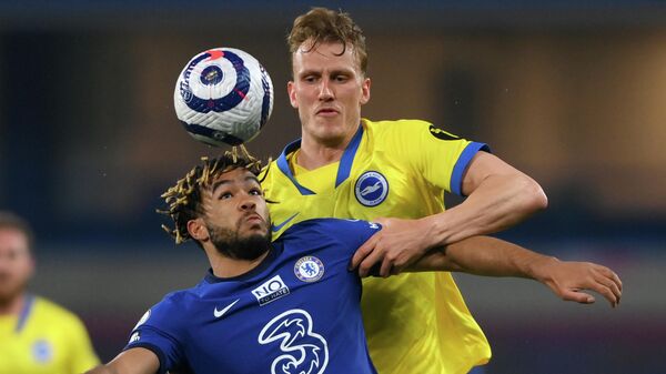 Chelsea's English defender Reece James (L) vies with Brighton's English defender Dan Burn during the English Premier League football match between Chelsea and Brighton and Hove Albion at Stamford Bridge in London on April 20, 2021. (Photo by Mike Hewitt / POOL / AFP) / RESTRICTED TO EDITORIAL USE. No use with unauthorized audio, video, data, fixture lists, club/league logos or 'live' services. Online in-match use limited to 120 images. An additional 40 images may be used in extra time. No video emulation. Social media in-match use limited to 120 images. An additional 40 images may be used in extra time. No use in betting publications, games or single club/league/player publications. / 