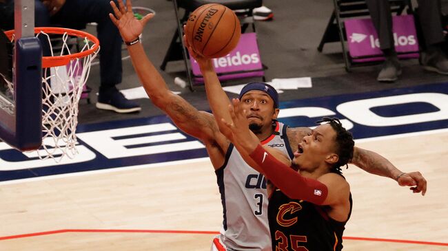 Apr 25, 2021; Washington, District of Columbia, USA; Washington Wizards guard Bradley Beal (3) prepares to block a shot by Cleveland Cavaliers forward Isaac Okoro (35) in the fourth quarter at Capital One Arena. Mandatory Credit: Geoff Burke-USA TODAY Sports