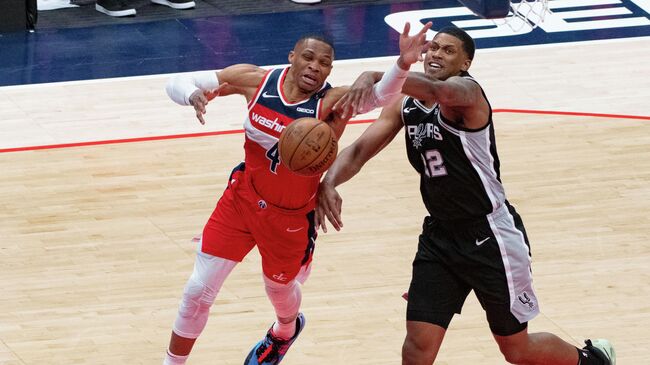 Apr 26, 2021; Washington, District of Columbia, USA; Washington Wizards guard Russell Westbrook (4) reacts after San Antonio Spurs forward Rudy Gay (22) makes contact during the second  half at Capital One Arena. Mandatory Credit: Tommy Gilligan-USA TODAY Sports