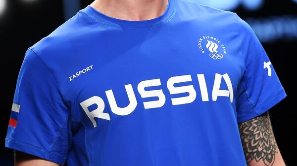 Модель демонстрирует одежду из новой коллекции официальной формы российских спортсменов для Олимпийских игр в Токио бренда Zasport в павильоне Космос 