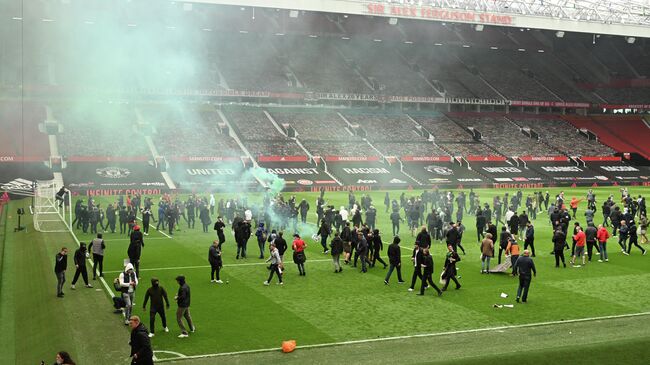 Supporters protest against Manchester United's owners, inside English Premier League club Manchester United's Old Trafford stadium in Manchester, north west England on May 2, 2021, ahead of their English Premier League fixture against Liverpool. - Manchester United were one of six Premier League teams to sign up to the breakaway European Super League tournament. But just 48 hours later the Super League collapsed as United and the rest of the English clubs pulled out. (Photo by Oli SCARFF / AFP)