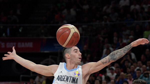 Argentina's Luca Vildoza goes for the ball during the Basketball World Cup semi-final game between Argentina and France in Beijing on September 13, 2019. (Photo by NOEL CELIS / AFP)
