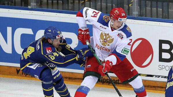 Игровой момент матча сборных России и Швеции по хоккею.
