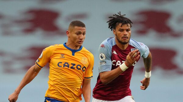Aston Villa's English defender Tyrone Mings (R) vies with Everton's Brazilian striker Richarlison during the English Premier League football match between Aston Villa and Everton at Villa Park in Birmingham, central England on May 13, 2021. (Photo by Alex Livesey / POOL / AFP) / RESTRICTED TO EDITORIAL USE. No use with unauthorized audio, video, data, fixture lists, club/league logos or 'live' services. Online in-match use limited to 120 images. An additional 40 images may be used in extra time. No video emulation. Social media in-match use limited to 120 images. An additional 40 images may be used in extra time. No use in betting publications, games or single club/league/player publications. / 