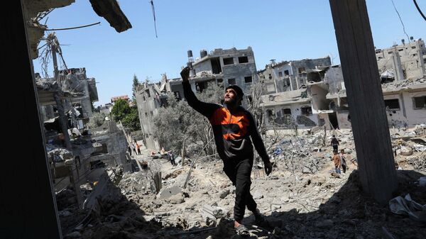 Разрушенные в результате израильских авиационных и артиллерийских ударов дома в северной части сектора Газа