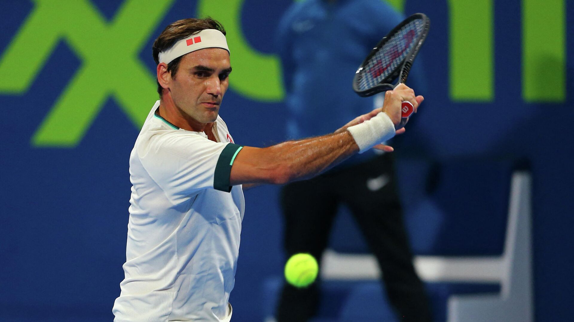 A handout picture obtained from the Qatar Tennis Federation on March 11, 2021, shows Roger Federer returns the ball during his match with Nikoloz Basilashvili of Georgia at the Qatar ExxonMobil Open at the Khalifa International Tennis and Squash Complex in the Qatari capital Doha. - Federer squandered a match point and was knocked out of the Qatar Open by Basilashvili in just his second match since a 13-month injury absence. (Photo by Samer Al-Rejjal / Qatar Tennis Federation / AFP) / RESTRICTED TO EDITORIAL USE - MANDATORY CREDIT AFP PHOTO / QATAR TENNIS FEDERATION  - NO MARKETING - NO ADVERTISING CAMPAIGNS - DISTRIBUTED AS A SERVICE TO CLIENTS - РИА Новости, 1920, 15.05.2021