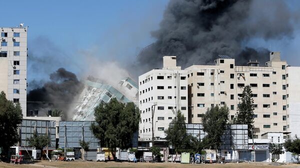 Обрушение здания в Газе, где располагались офисы международных СМИ
