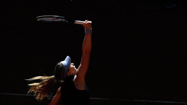 Spain's Paula Badosa returns the ball to Switzerland's Belinda Bencic during their 2021 WTA Tour Madrid Open tennis tournament singles match at the Caja Magica in Madrid on May 5, 2021. (Photo by OSCAR DEL POZO / AFP)