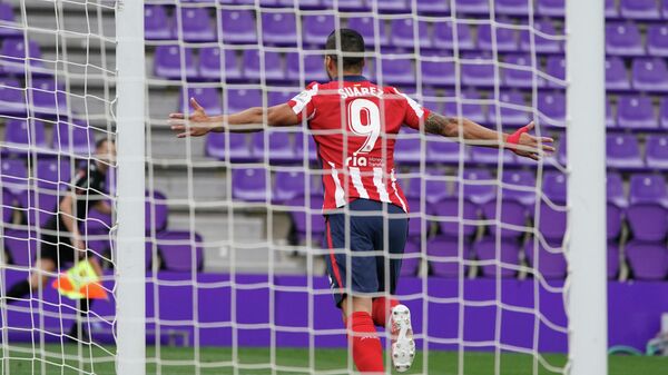 Atletico Madrid's Uruguayan forward Luis Suarez  celebrates after scoring during the Spanish league football match Real Valladolid FC against Club Atletico de Madrid at the Jose Zorilla stadium in Valladolid on May 22, 2021. (Photo by CESAR MANSO / AFP)