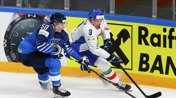 Ice Hockey - IIHF World Ice Hockey Championship 2021 - Group B - Finland v Italy - Arena Riga, Riga, Latvia - May 27, 2021 Finland's Miika Koivisto in action with Italy's Markus Gander REUTERS/Ints Kalnins