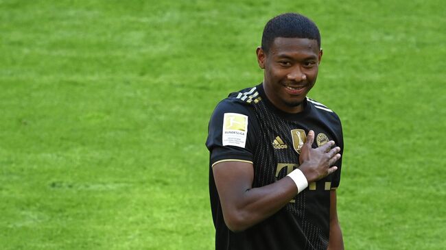 Bayern Munich's Austrian defender David Alaba gestures prior the German first division Bundesliga football match Bayern Munich vs FC Augsburg in Munich, southern Germany, on May 22, 2021. (Photo by CHRISTOF STACHE / POOL / AFP) / DFL REGULATIONS PROHIBIT ANY USE OF PHOTOGRAPHS AS IMAGE SEQUENCES AND/OR QUASI-VIDEO