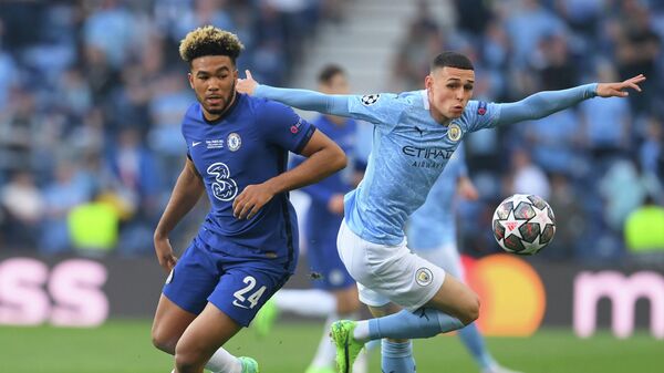 Soccer Football - Champions League Final - Manchester City v Chelsea - Estadio do Dragao, Porto, Portugal - May 29, 2021  Chelsea's Reece James in action with Manchester City's Phil Foden Pool via REUTERS/David Ramos