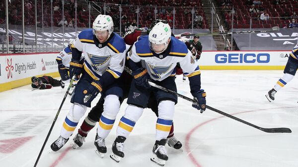 GLENDALE, ARIZONA - FEBRUARY 15: Carl Gunnarsson #4 and Ivan Barbashev #49 of the St. Louis Blues controls the puck during the third period of the NHL game against the Arizona Coyotes at Gila River Arena on February 15, 2021 in Glendale, Arizona. The Coyotes defeated the Blues 1-0.   Christian Petersen/Getty Images/AFP (Photo by Christian Petersen / GETTY IMAGES NORTH AMERICA / Getty Images via AFP)