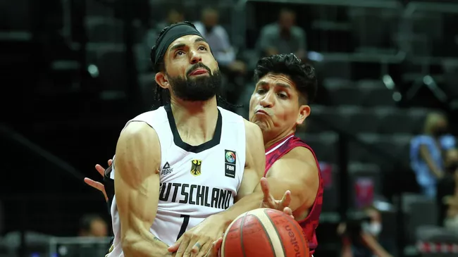 Basketball - FIBA Olympic Qualifying Tournament - Germany v Mexico - Spaladium Arena, Split, Croatia - June 29, 2021  Germany's Joshiko Saibou in action with Mexico's Orlando Mendez REUTERS/Antonio Bronic