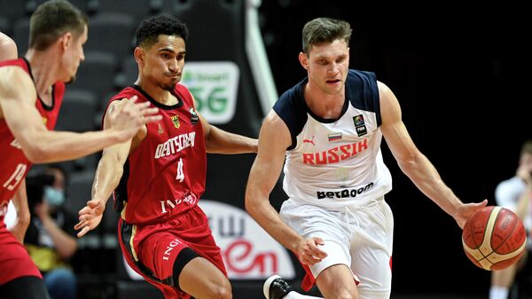 Russia's Ivan Ukhov (R) fights for the ball with Germany's Maodo Lo  during the FIBA Men’s Olympic Qualifying Tournament match between Russial and Germany, on July 1, 2021, in Split. (Photo by Denis LOVROVIC / AFP)